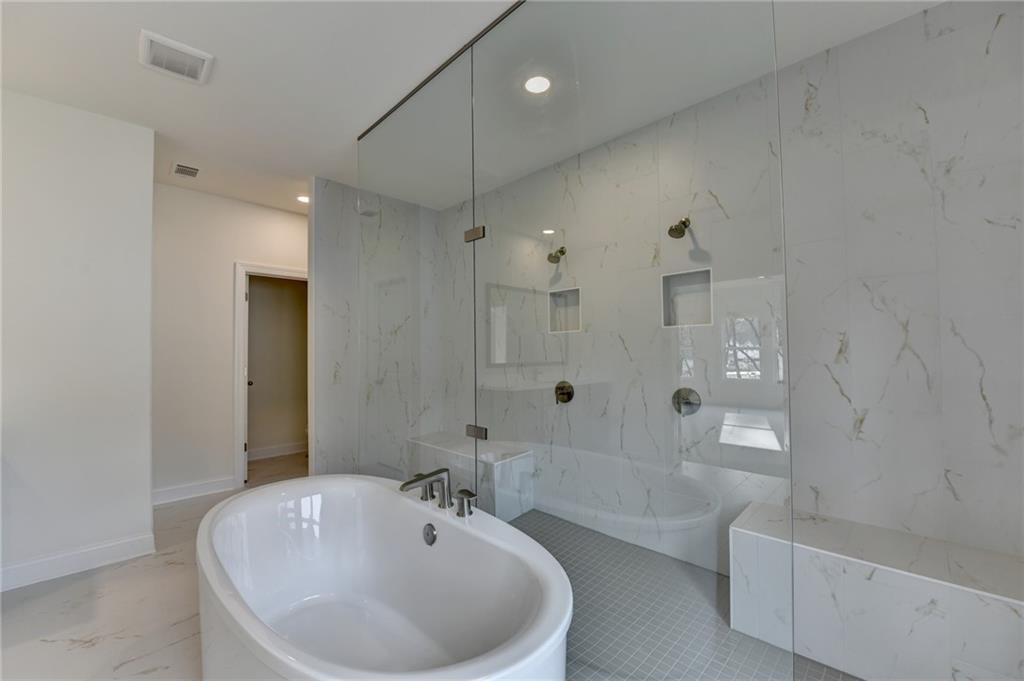 2470 Stewart Road Cumming, GA 30041 - Photo 48 of 61 a bathroom with a bathtub and a sink