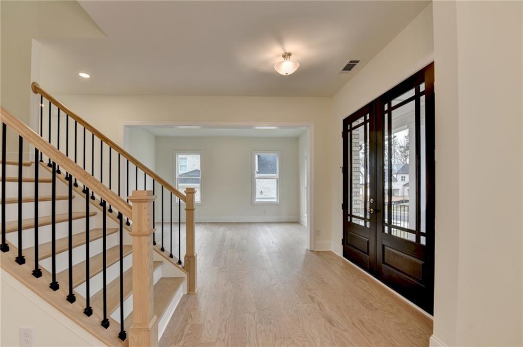 2470 Stewart Road Cumming, GA 30041 - Photo 7 of 61 a view of an entryway with wooden floor and door