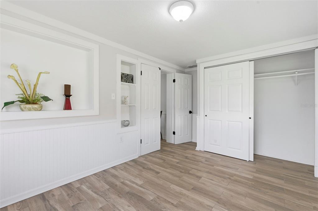 9033 Pegasus Avenue Port Richey, FL 34668 - Photo 21 of 56 a view of empty room with wooden floor