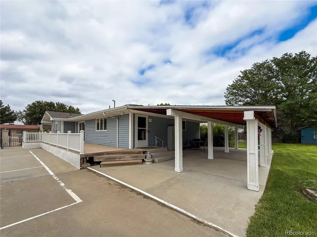 a view of a storage space with wooden fence