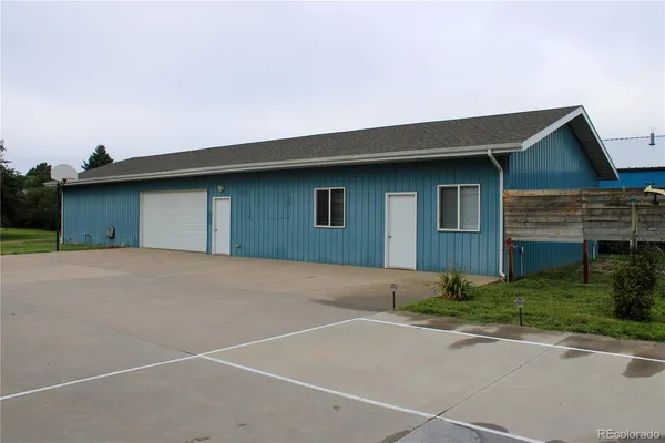 a view of staircase with white walls and railing
