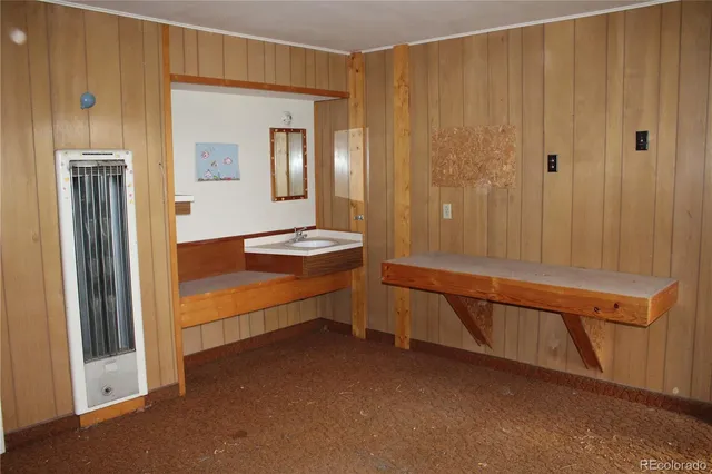 a view of an empty room with a fireplace