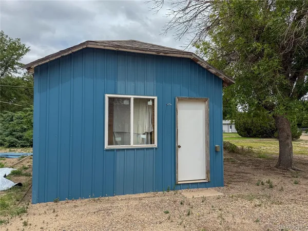 a wooden door in front of a house