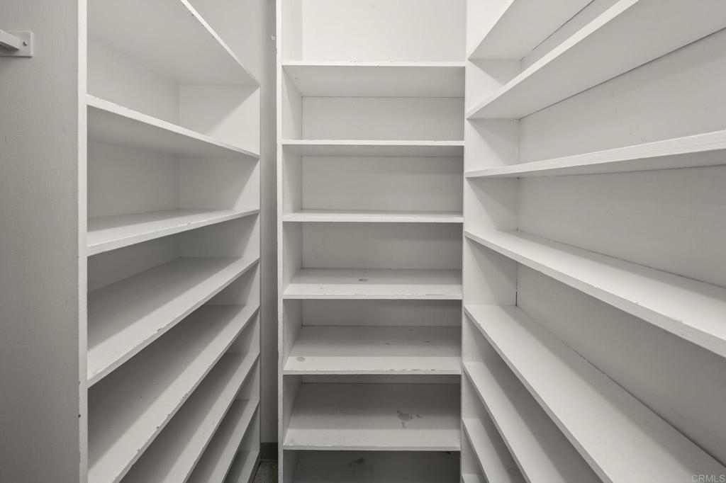 14048 San Pasqual Valley Road Escondido, CA 92027 - Photo 22 of 55 a view of walk in closet with empty racks