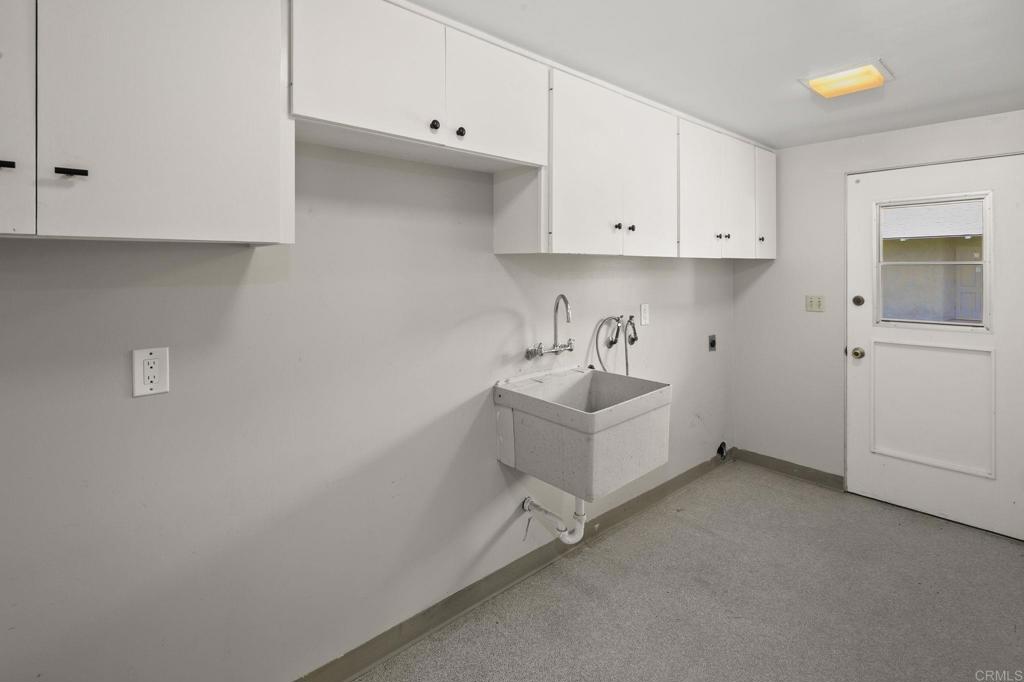 14048 San Pasqual Valley Road Escondido, CA 92027 - Photo 23 of 55 a white room with cabinets