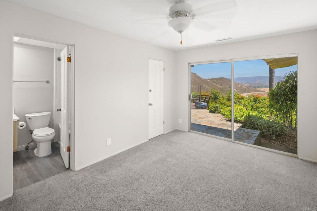 14048 San Pasqual Valley Road Escondido, CA 92027 - Photo 24 of 55 a view of a room with a porch and garden