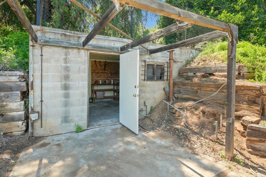 14048 San Pasqual Valley Road Escondido, CA 92027 - Photo 54 of 55 a view of a house with a yard