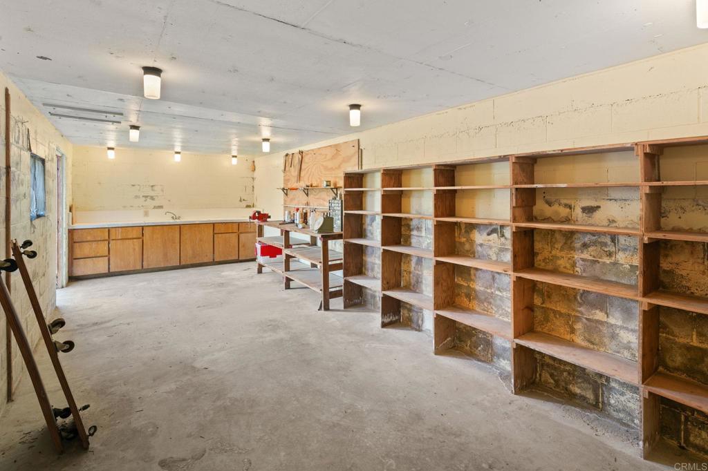14048 San Pasqual Valley Road Escondido, CA 92027 - Photo 55 of 55 a view of an empty room with a cabinet and mirrors