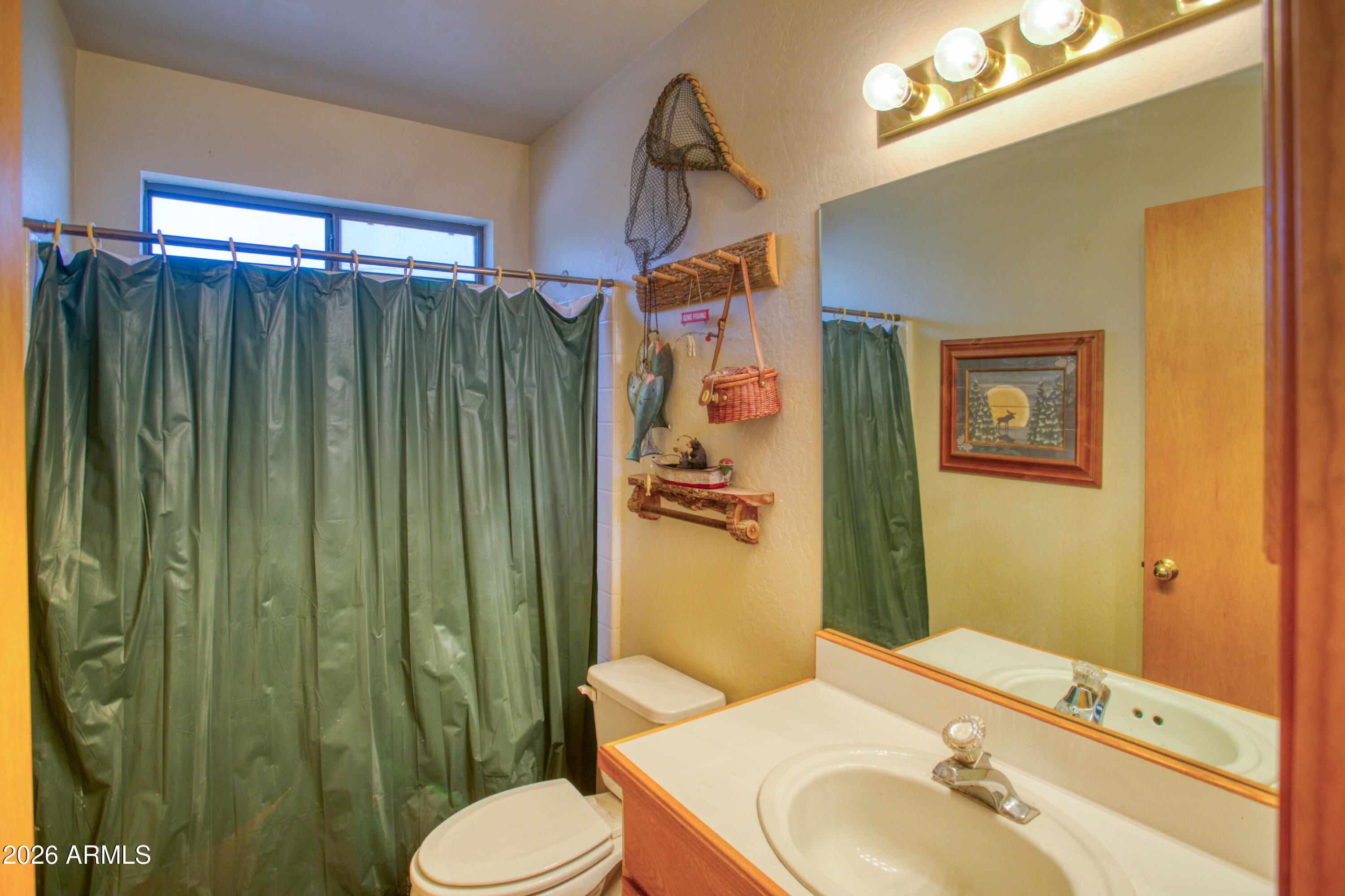 146 Deer Run Road Pinetop, AZ 85935 - Photo 16 of 44 a bathroom with a sink toilet and shower