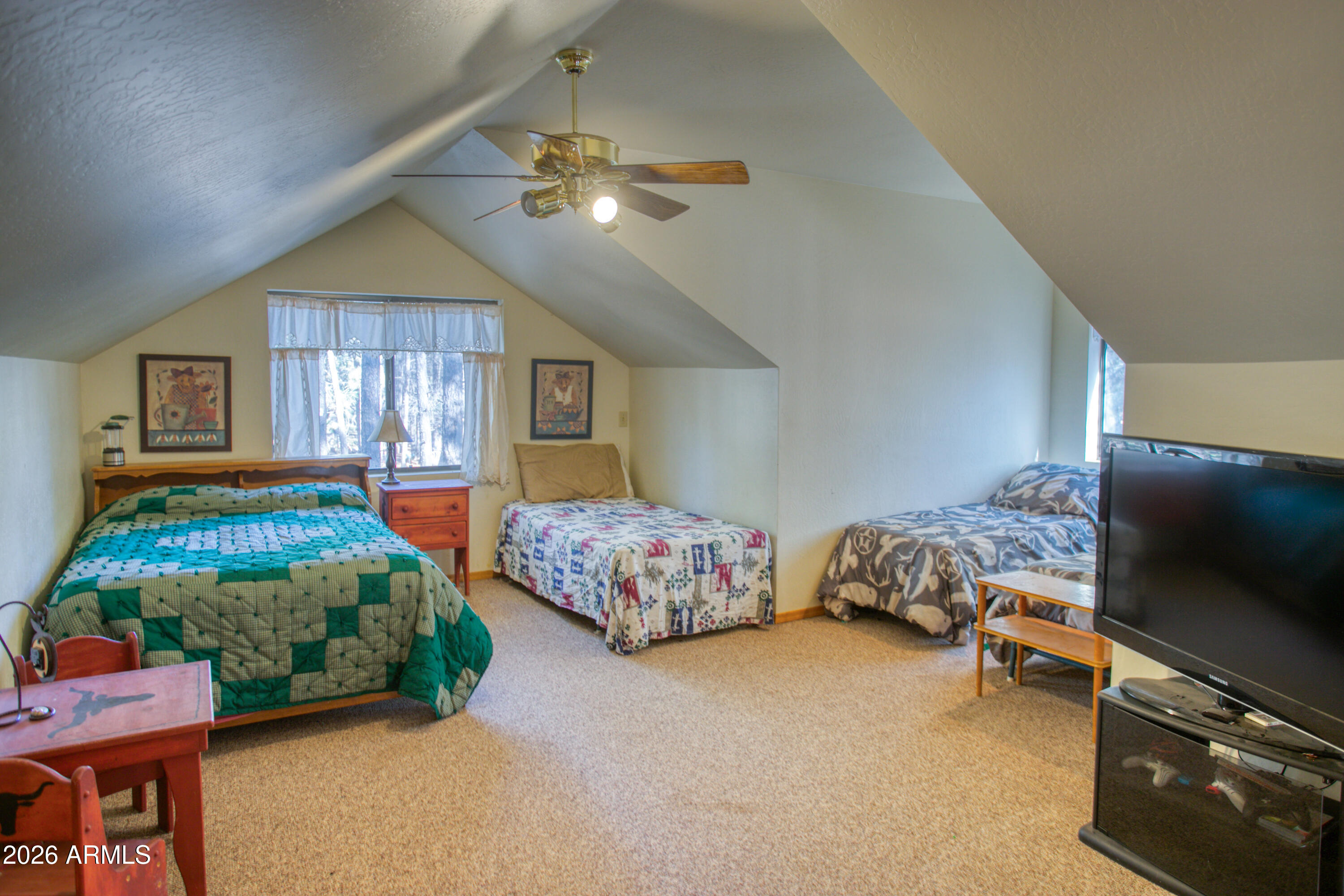 146 Deer Run Road Pinetop, AZ 85935 - Photo 18 of 44 a bedroom with bed and window