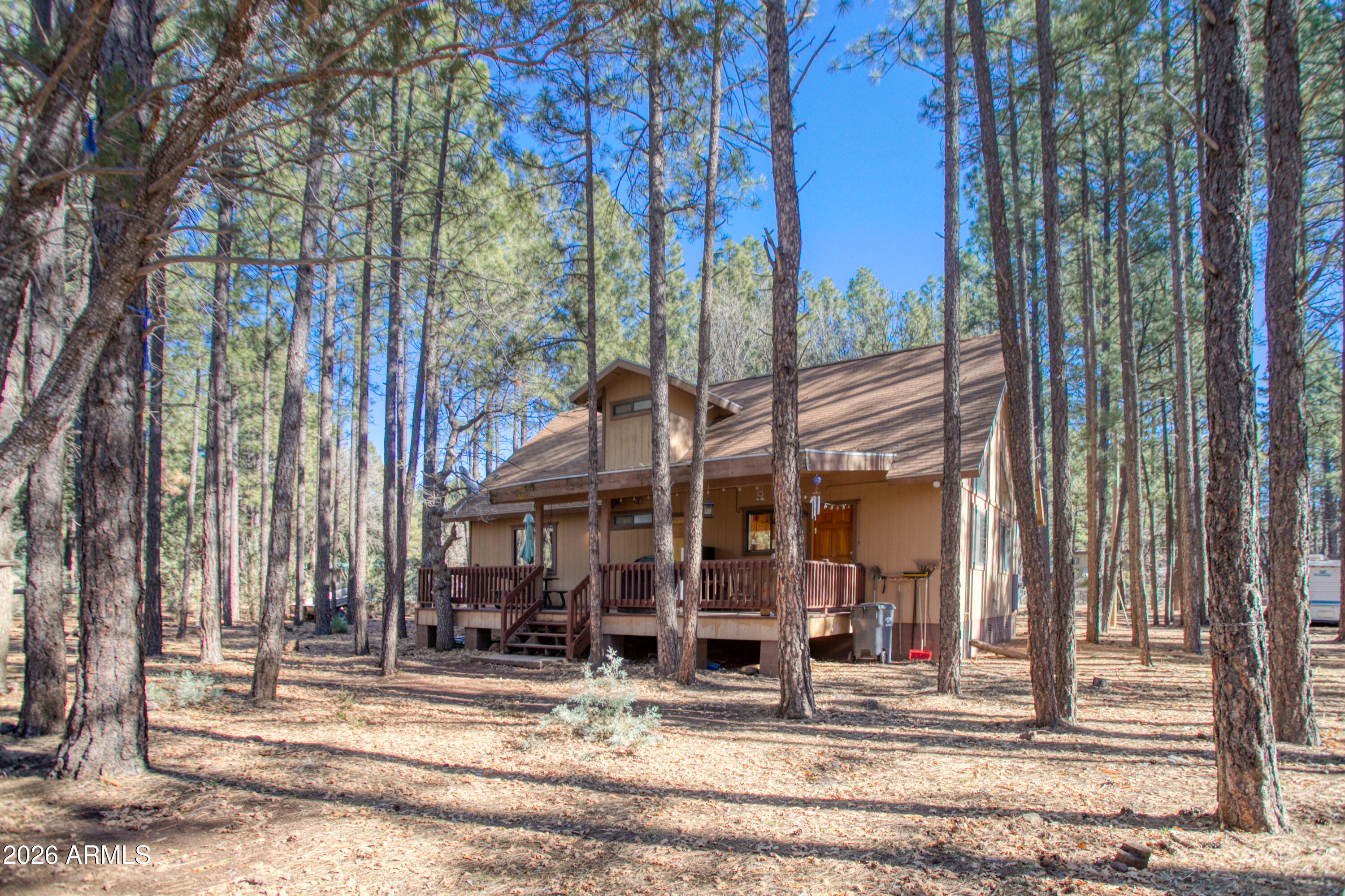 146 Deer Run Road Pinetop, AZ 85935 - Photo 22 of 44 a view of a building and a tree