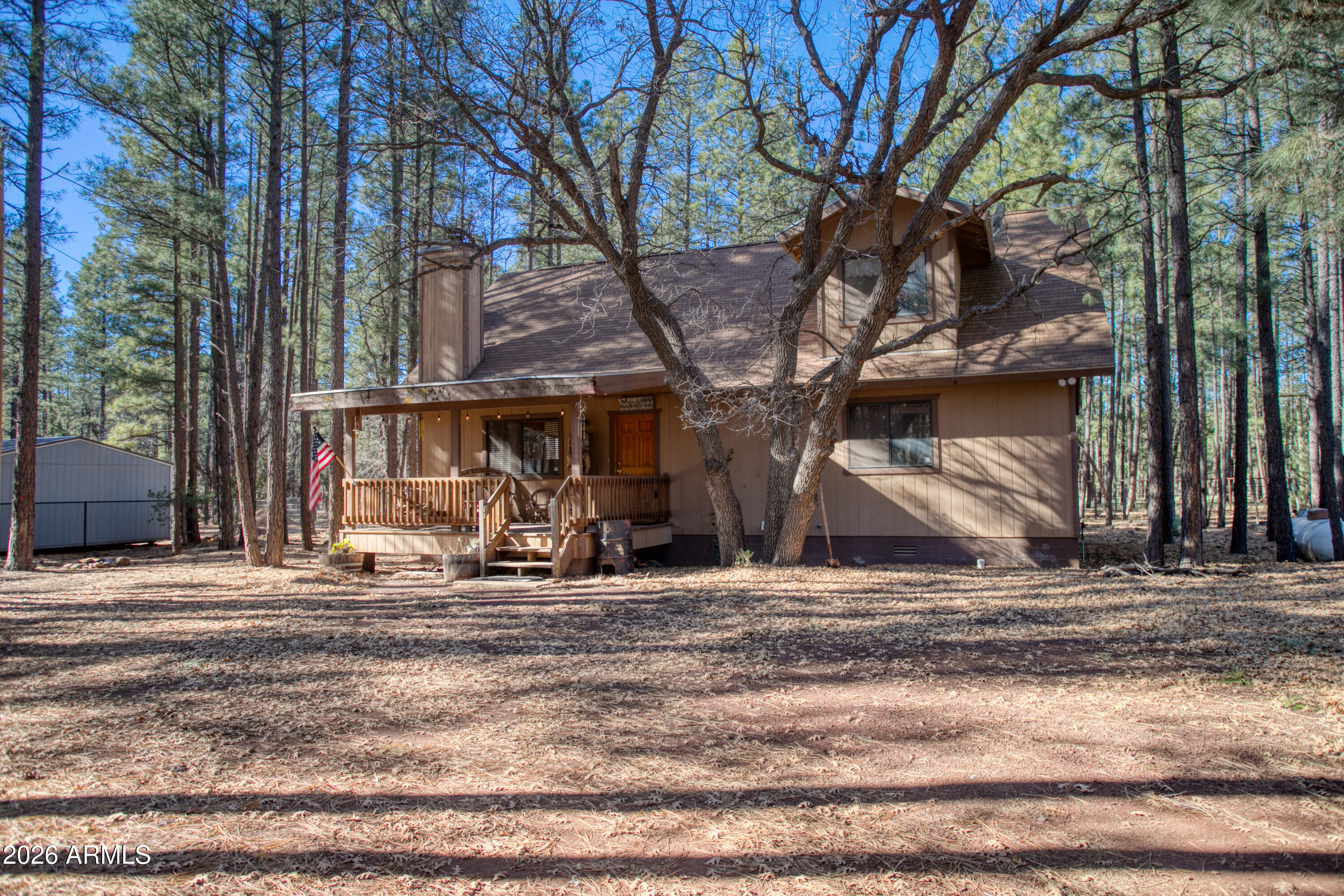 146 Deer Run Road Pinetop, AZ 85935 - Photo 28 of 44 a view of a house with car parked next to a road