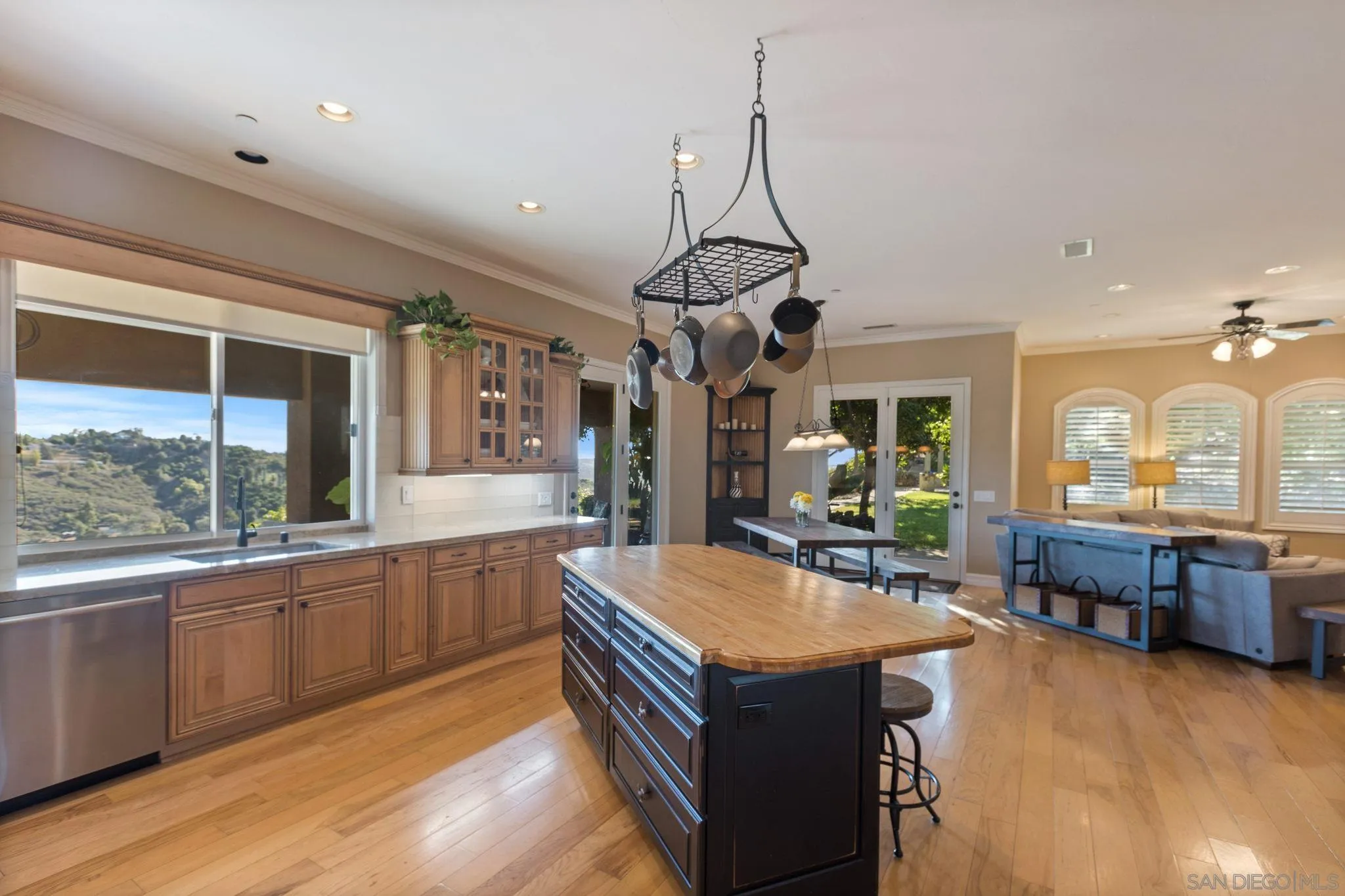 30419 Canyon Estates Road Vista, CA 92084 - Photo 22 of 75 a kitchen with stainless steel appliances granite countertop a sink a stove and a wooden floors