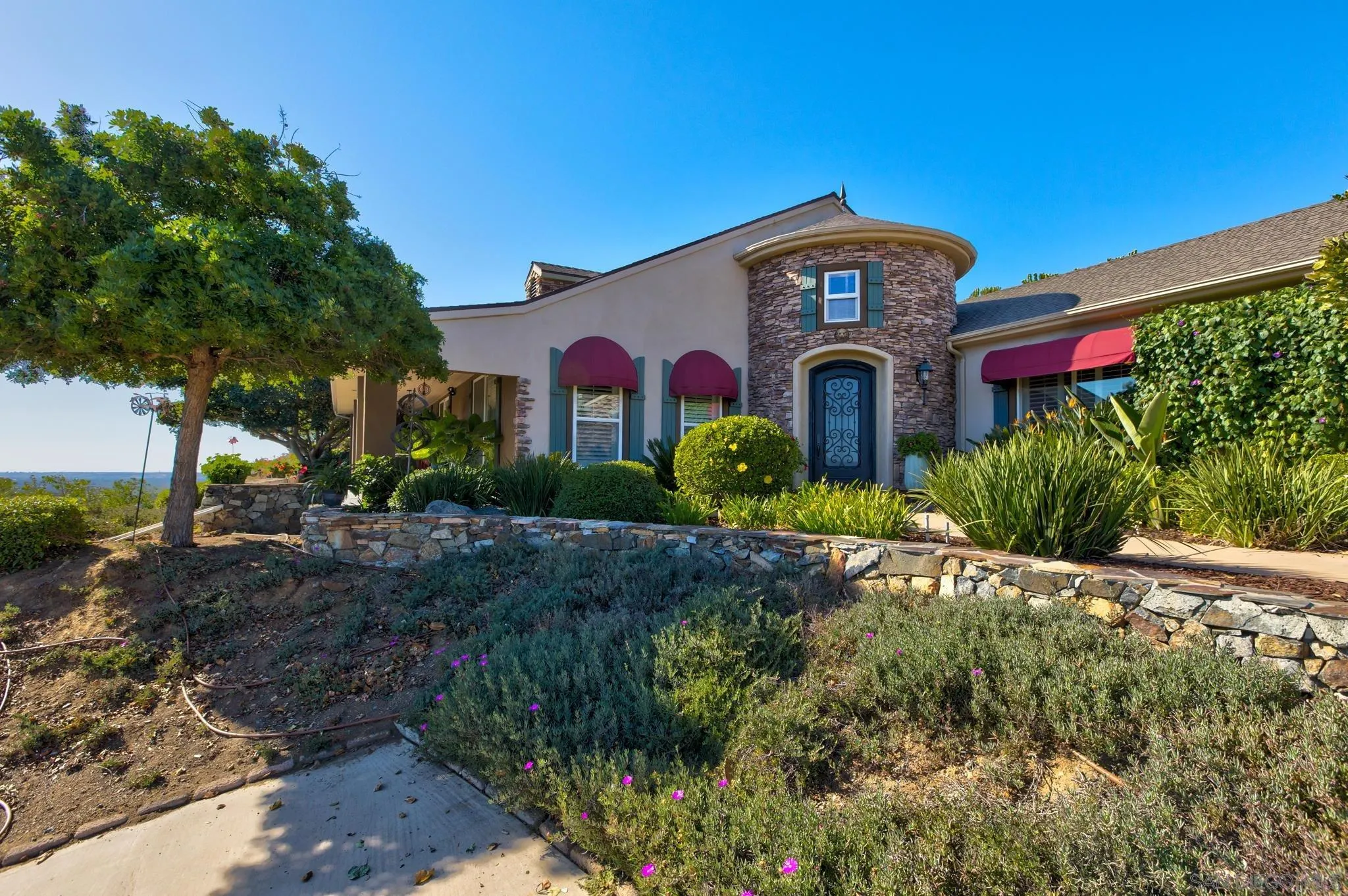 30419 Canyon Estates Road Vista, CA 92084 - Photo 3 of 75 a front view of a house with a yard