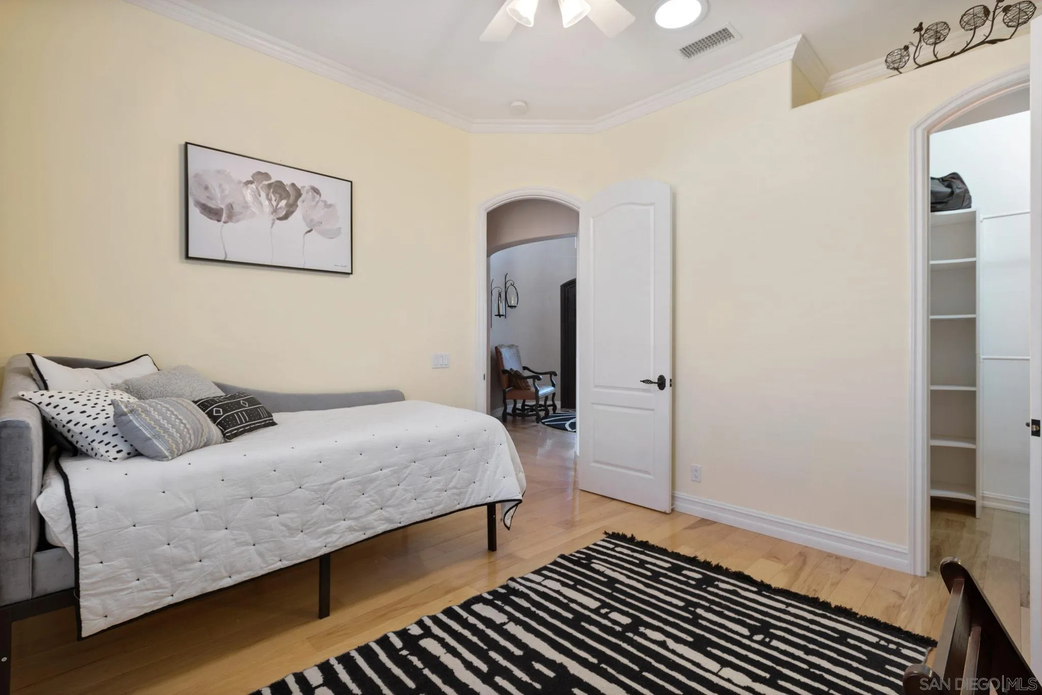 30419 Canyon Estates Road Vista, CA 92084 - Photo 34 of 75 a bedroom with a bed and a mirror