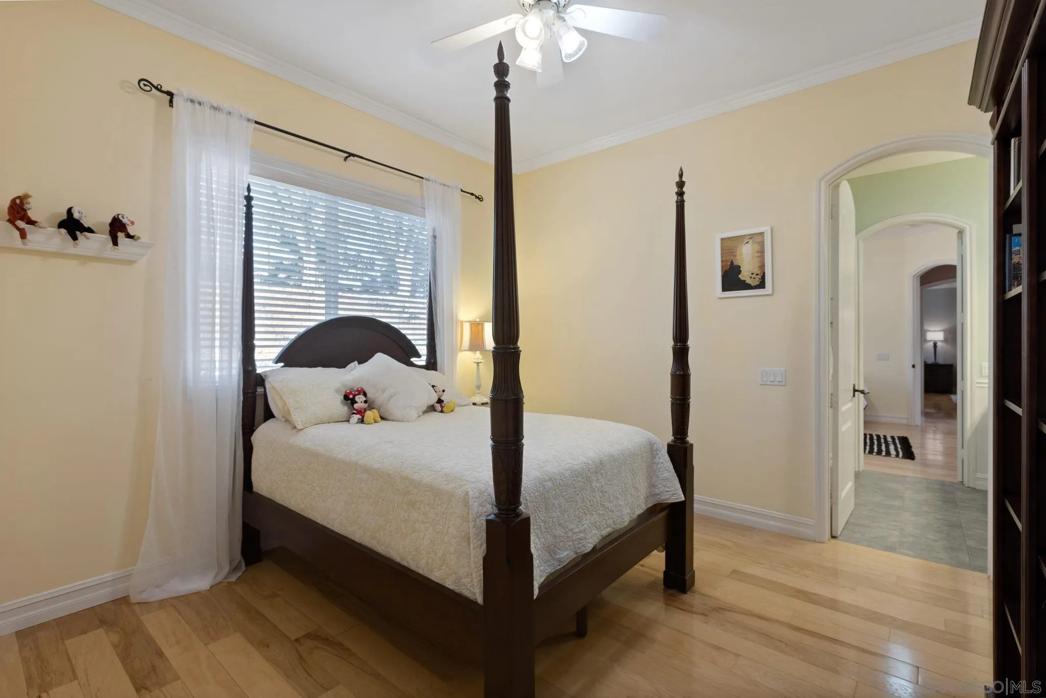 30419 Canyon Estates Road Vista, CA 92084 - Photo 38 of 75 a bedroom with a bed and a chandelier