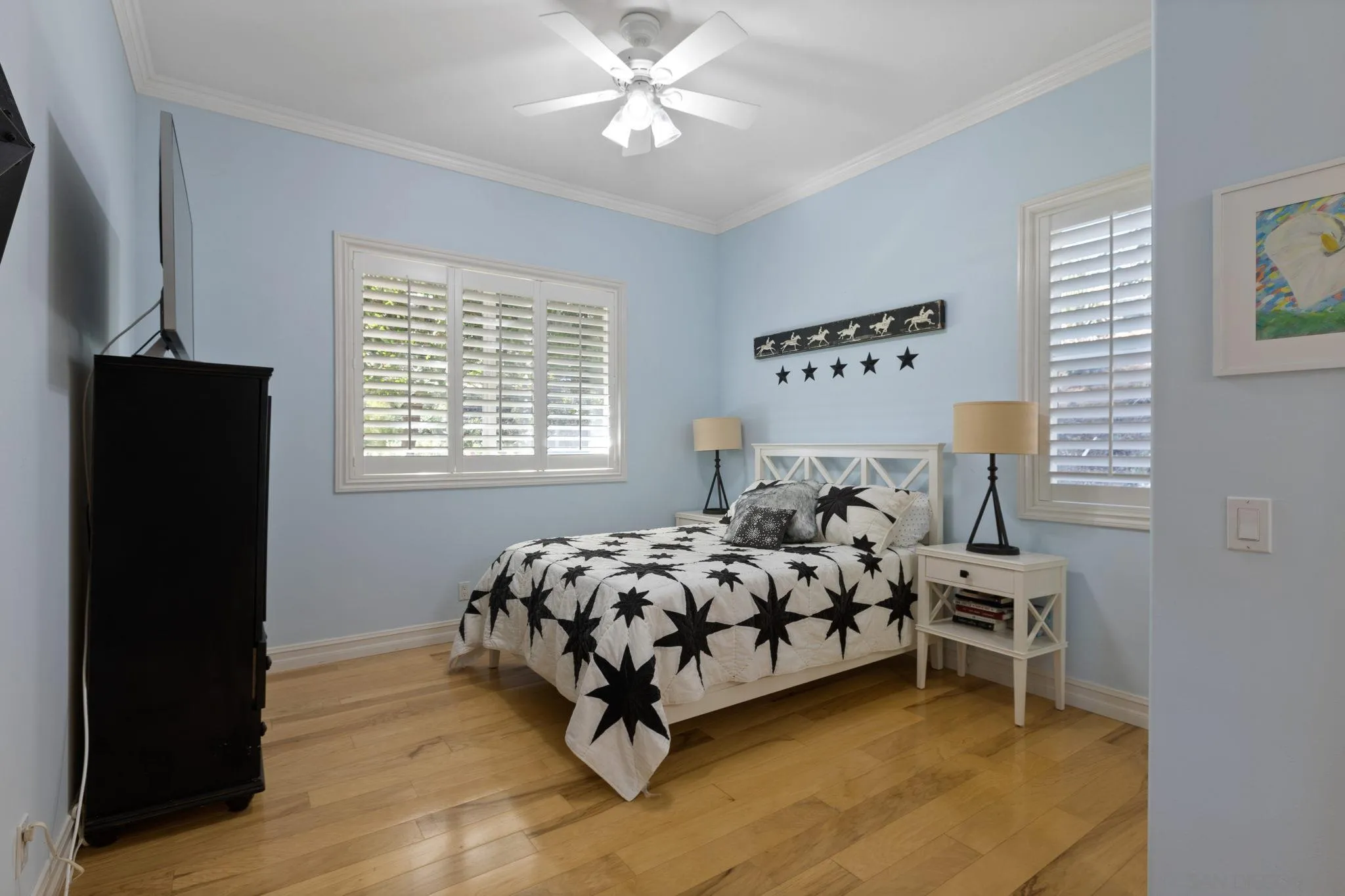30419 Canyon Estates Road Vista, CA 92084 - Photo 39 of 75 a bed sitting in a bedroom next to a window and a flat screen tv