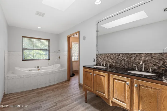 a bathroom with a bathtub and a sink