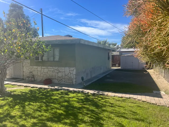 a view of a back yard of the house