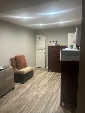 a bedroom with a bed and a mirror