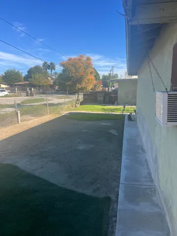 a view of a swimming pool with an outdoor space and seating area