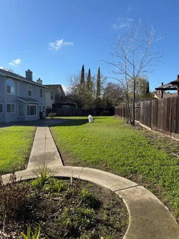 a view of a garden with a swimming pool