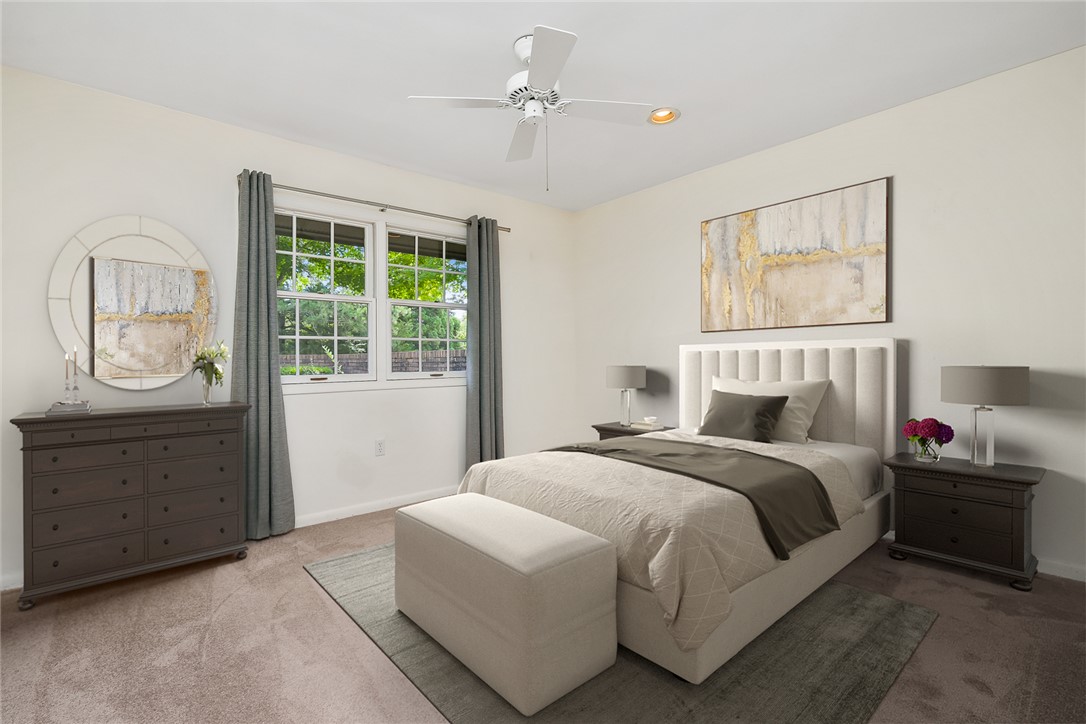 34 Hickory Way Clemson, SC 29631 - Photo 32 of 39 Well-lit sleeping quarters with a pair of large windows overlooking greenery, offering a peaceful retreat.