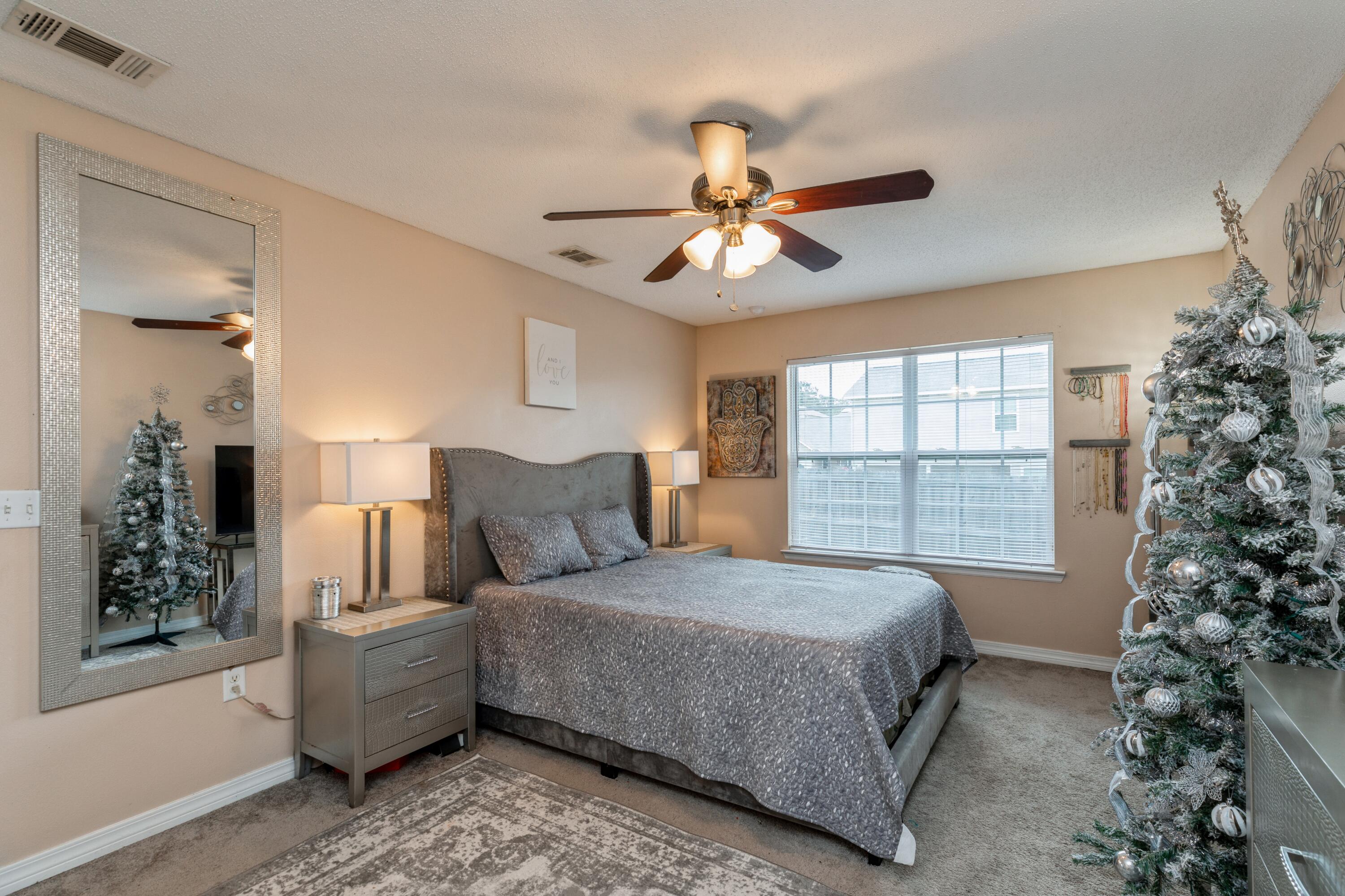 200 Wainwright Drive Crestview, FL 32539 - Photo 12 of 17 a bedroom with a large bed and a window