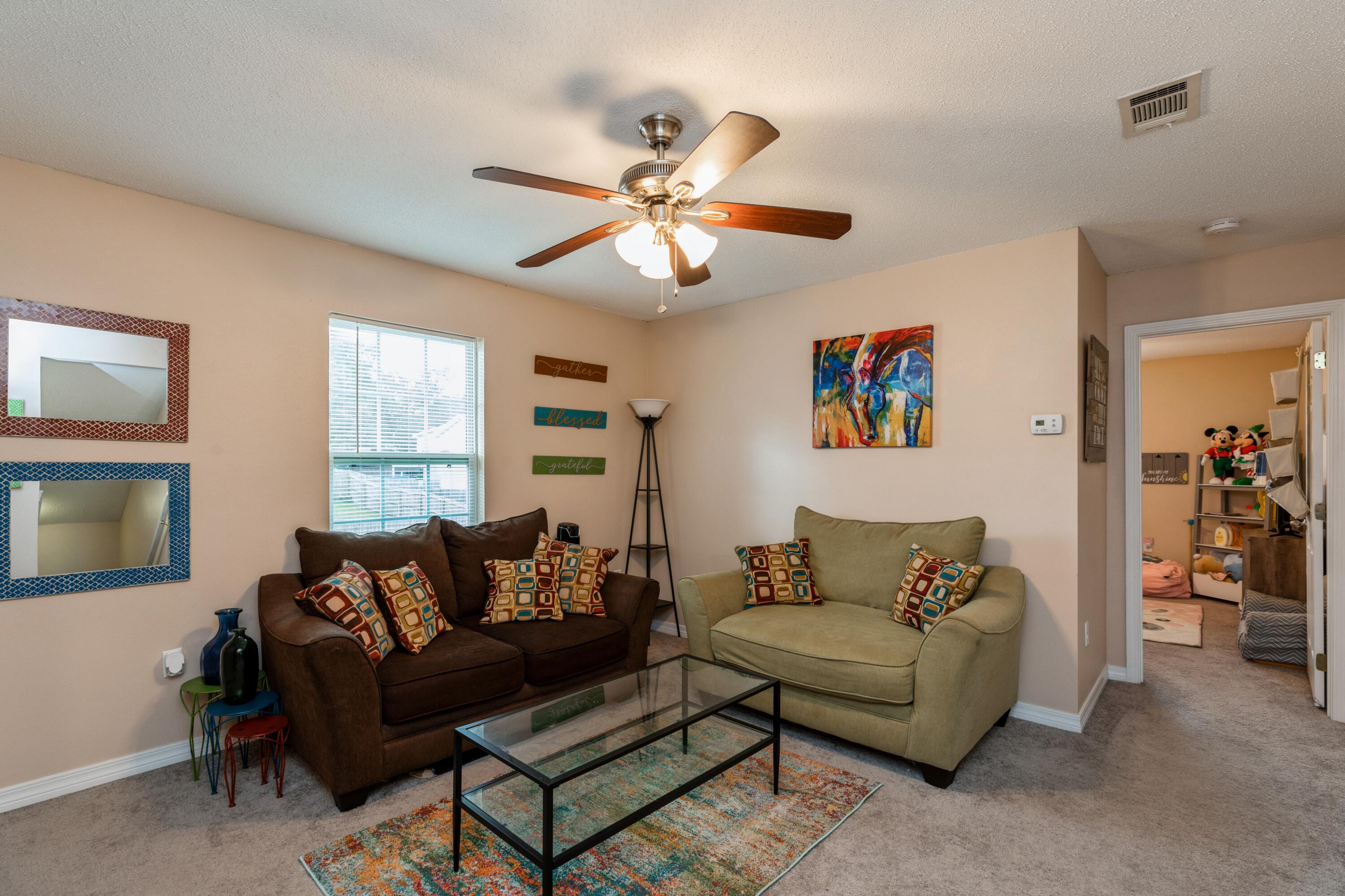 200 Wainwright Drive Crestview, FL 32539 - Photo 13 of 17 a living room with furniture and a window
