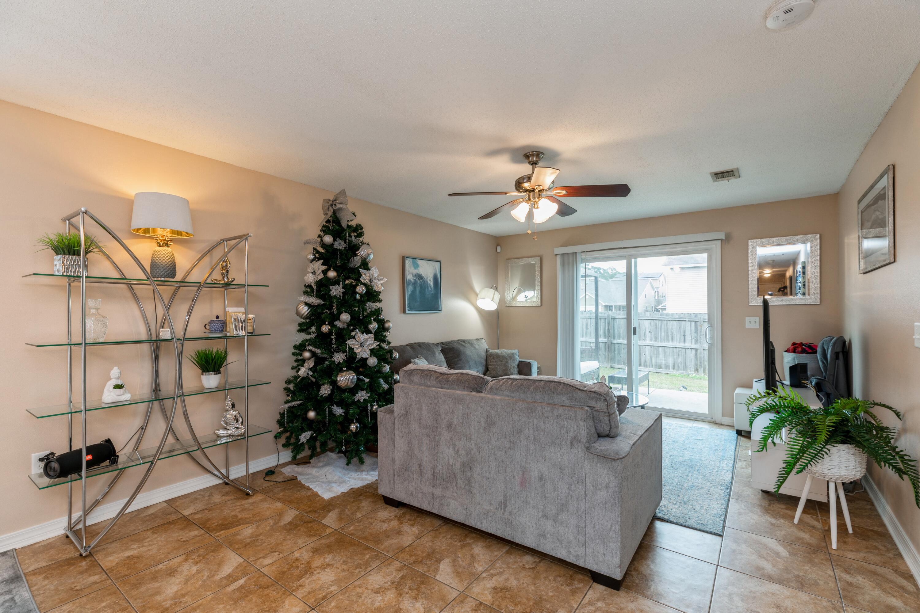 200 Wainwright Drive Crestview, FL 32539 - Photo 9 of 17 a living room with furniture and a chandelier