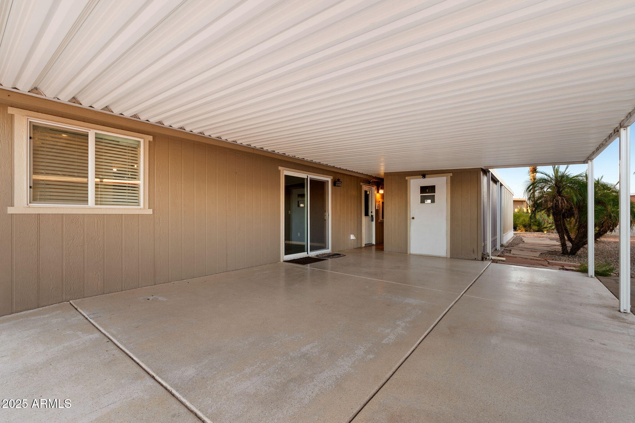 2400 East Baseline Avenue, Unit 144 Apache Junction, AZ 85119 - Photo 2 of 13 an empty room with windows