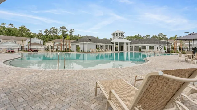a view of a swimming pool with a patio
