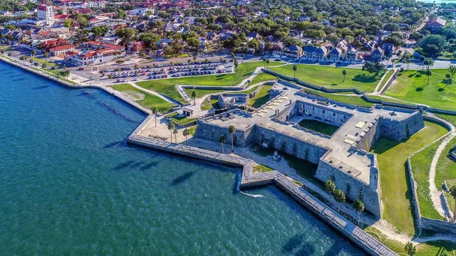 a view of a lake with a house in the background