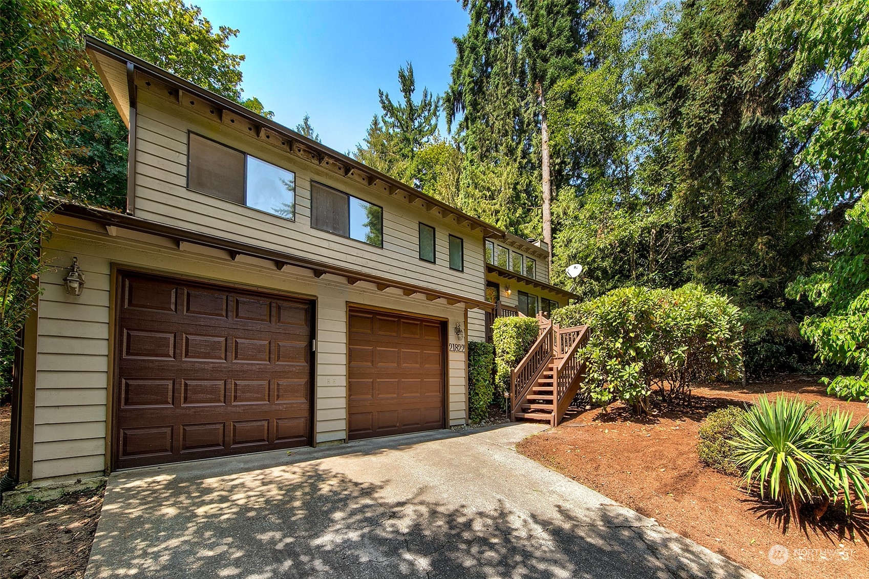21822 4th Avenue Southeast Bothell, WA 98021 - Photo 20 of 40 a front view of a house with a yard and garage