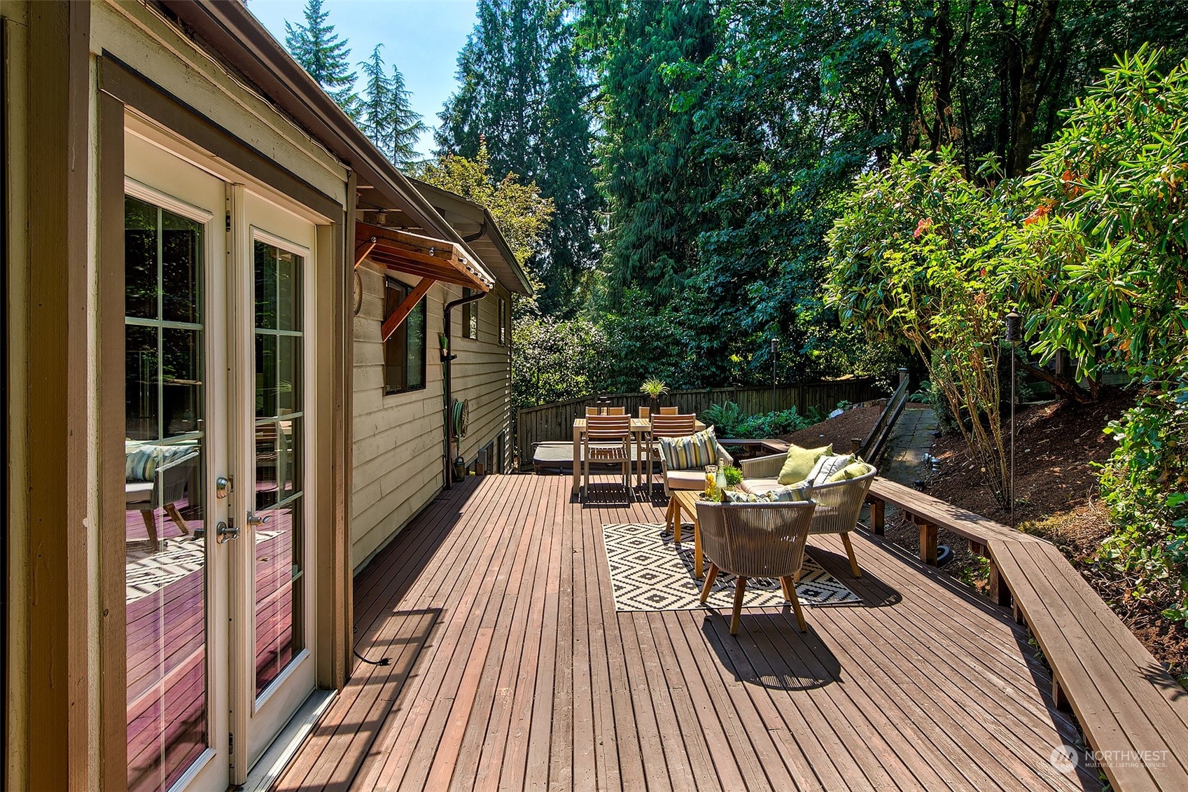 21822 4th Avenue Southeast Bothell, WA 98021 - Photo 21 of 40 a balcony with wooden floor table and chairs
