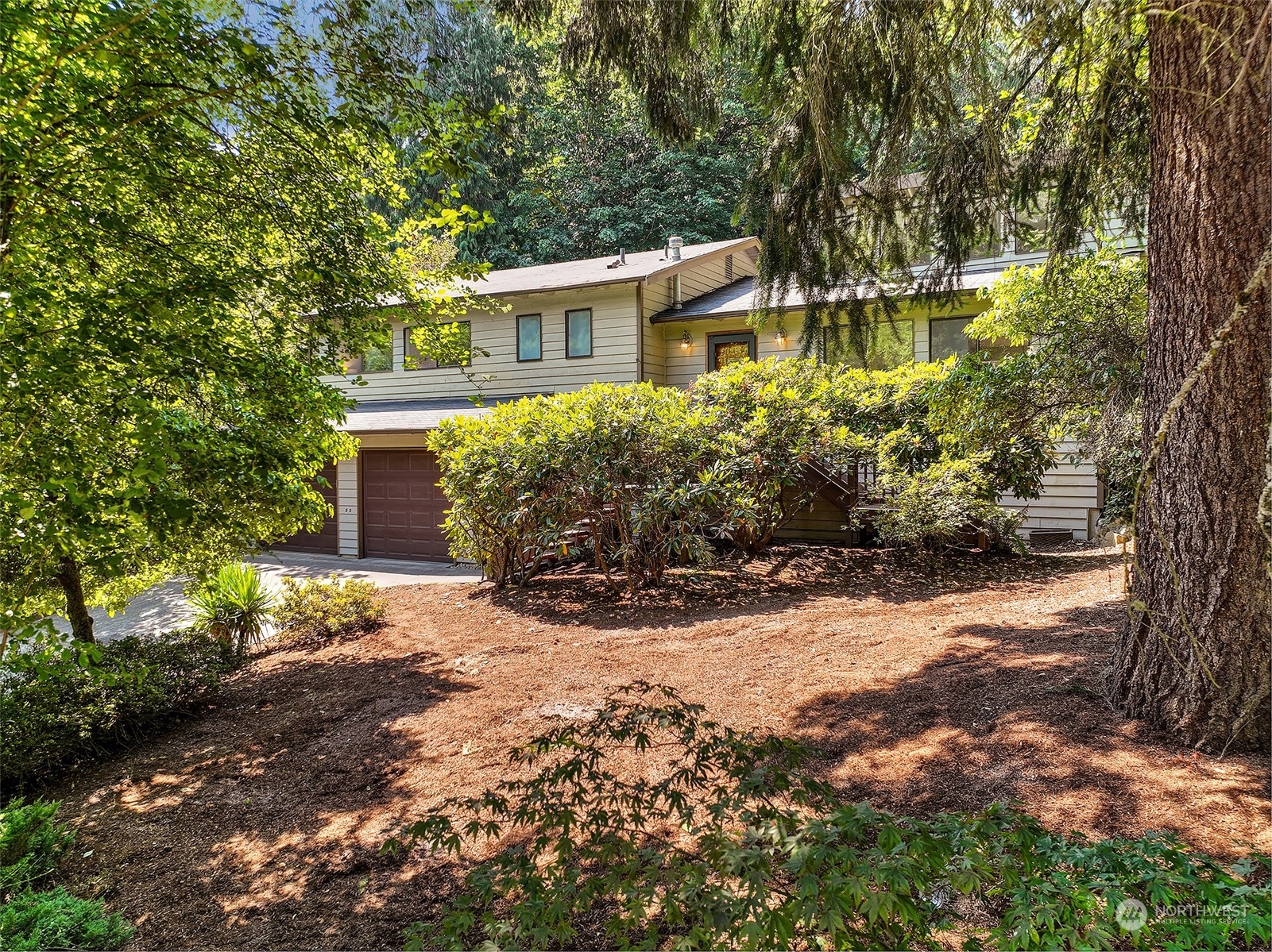 21822 4th Avenue Southeast Bothell, WA 98021 - Photo 28 of 40 a front view of a house with a yard and a garden