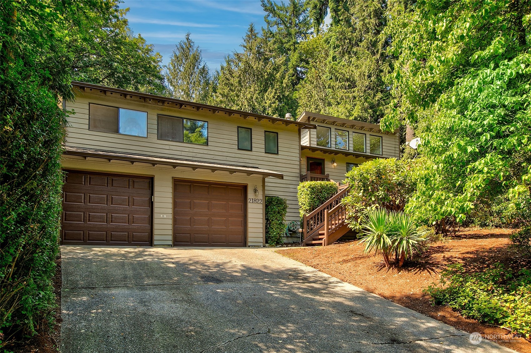 21822 4th Avenue Southeast Bothell, WA 98021 - Photo 36 of 40 a front view of a house with a yard and garage