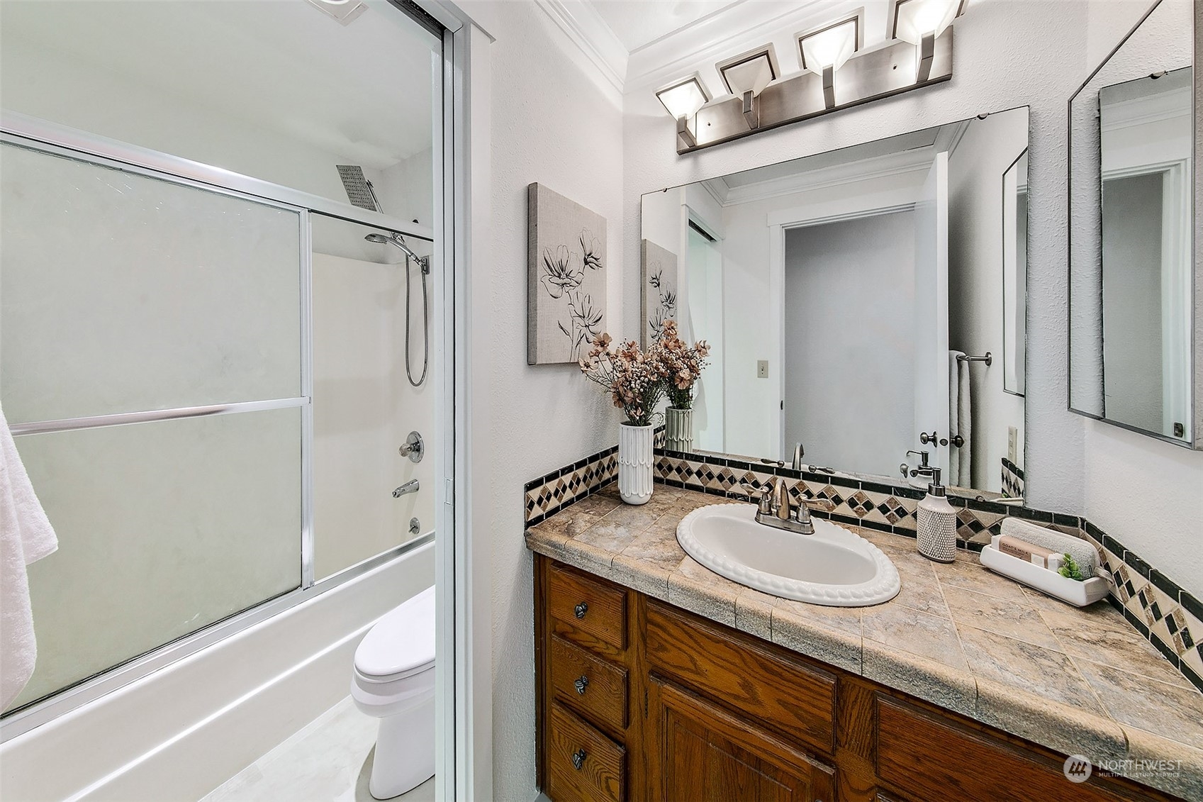 21822 4th Avenue Southeast Bothell, WA 98021 - Photo 8 of 40 a bathroom with a granite countertop sink toilet and shower