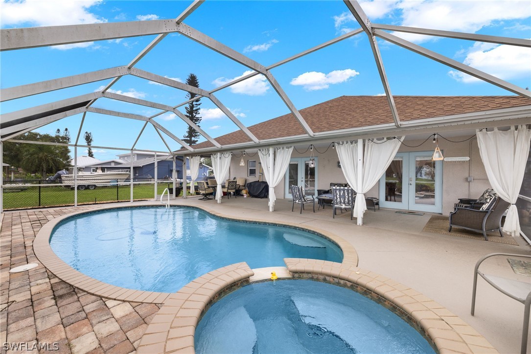 12413 River Road Fort Myers, FL 33905 - Photo 8 of 30 a view of a swimming pool with seating area