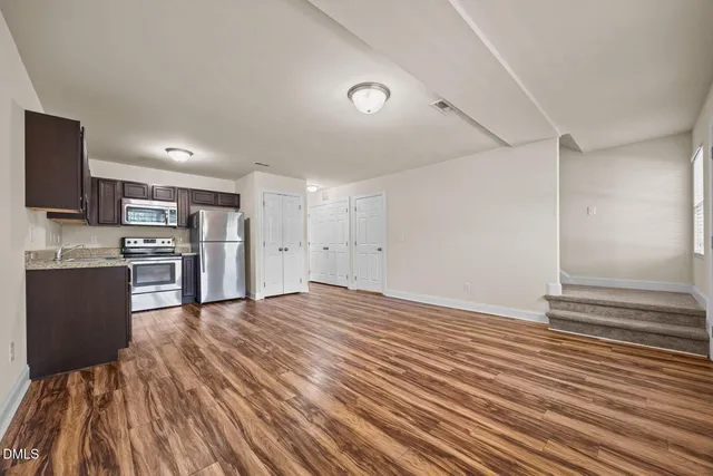 a view of kitchen and wooden floor