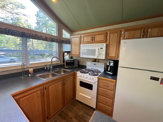 2795 East 28th Road Marseilles, IL 61341 - Photo 25 of 75 a kitchen with stainless steel appliances granite countertop a refrigerator a sink a stove and white cabinets with wooden floor