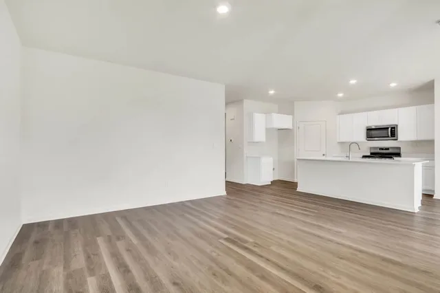 a view of kitchen with wooden floor
