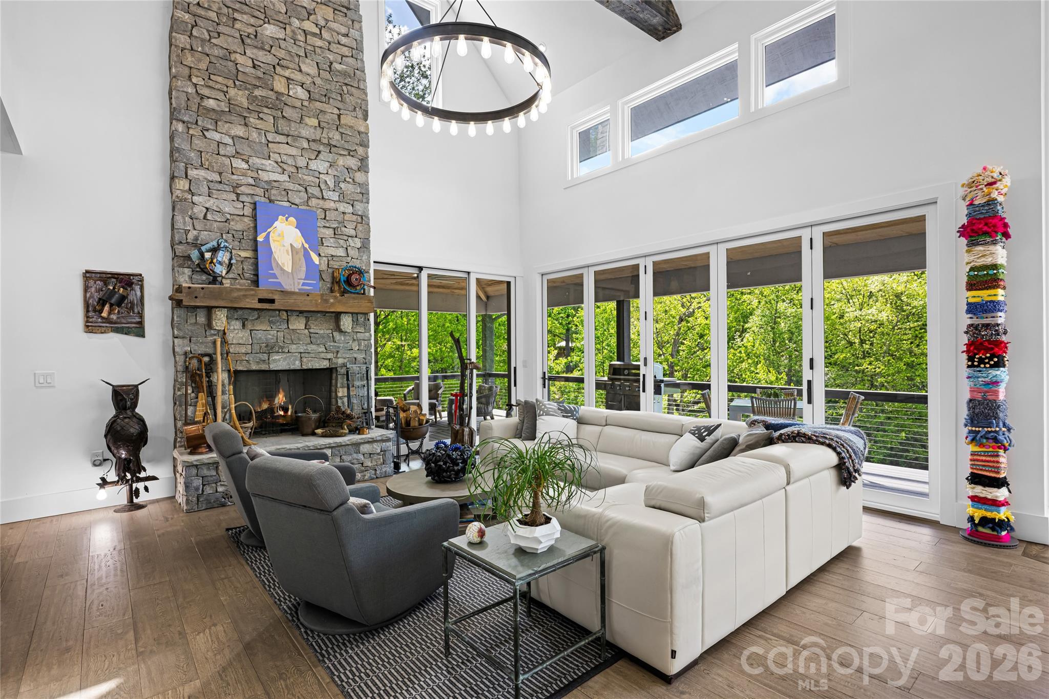 2235 Cold Mountain Road Lake Toxaway, NC 28747 - Photo 6 of 47 a living room with furniture and a fireplace