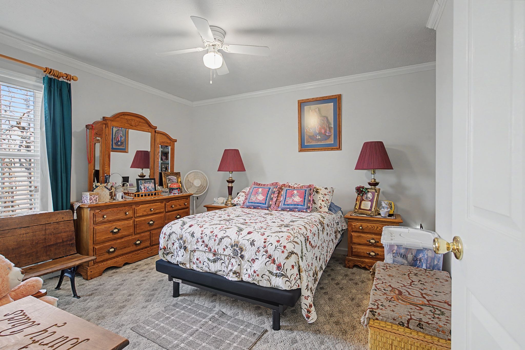 1075 Coker Ford Road Portland, TN 37148 - Photo 24 of 35 a bedroom with a bed and a dresser in it