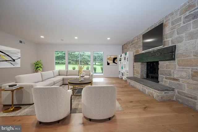 a living room with a couch and a fireplace