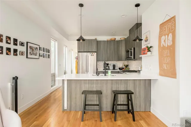 a view of dining room and kitchen with a table chairs