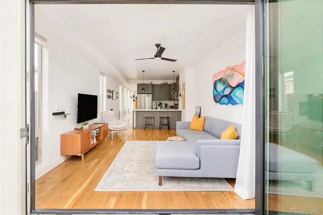a living room with furniture and flat screen tv