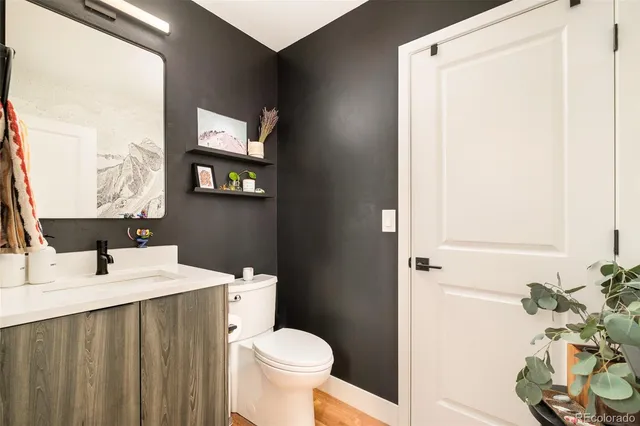 a bathroom with a sink toilet and vanity