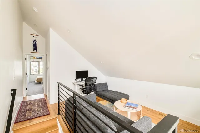 a bedroom with a bed chair and a window