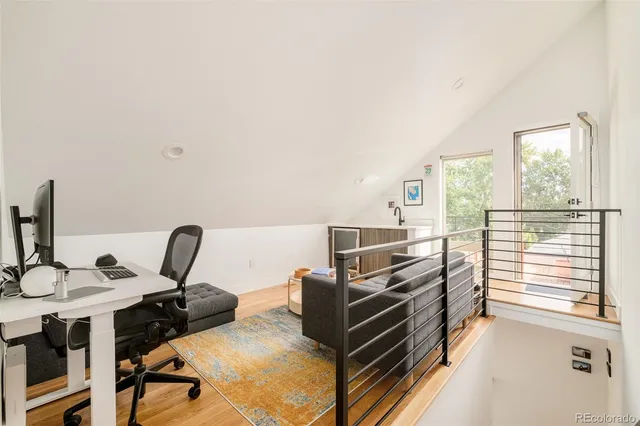 a view of a balcony with an outdoor seating